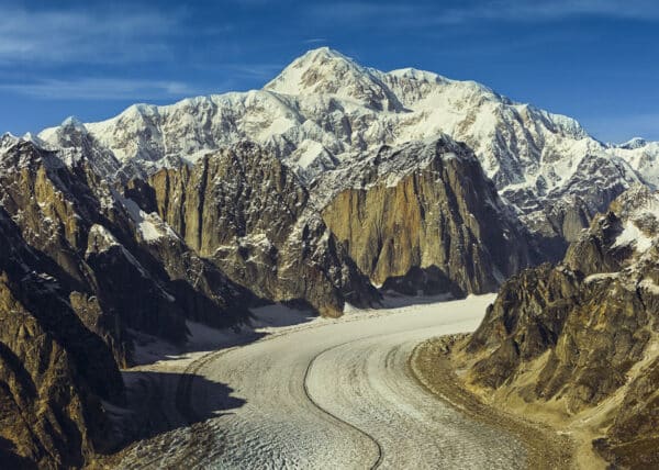 Aerial of  Denail (Mount McKinley) over the Ruth Glacier, ice falls and great gorge.  Summer, Alaska.